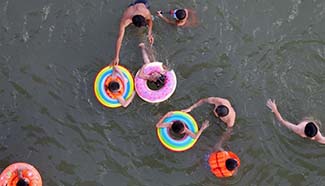 Guangxi issues blue alarm over high temperatures