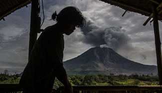 Indonesia volcano spews column of ash smoke into air