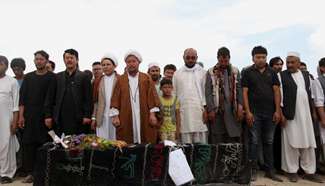 People offer funeral prayers to victims of suicide attack in Kabul
