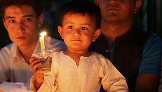 People attend candlelight vigil to commemorate victims of Kabul bomb attack