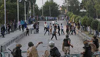 Protesters clash with Indian paramilitary troopers in Srinagar, Kashmir