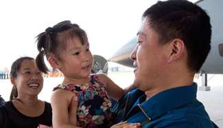 PLA pilots greeted by their children after air force competition