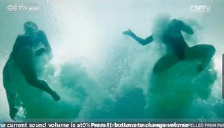 Olympic diving pool turns green