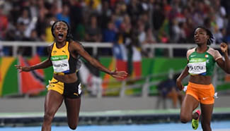 Elaine Thompson wins gold for Jamaica in women's 100m race