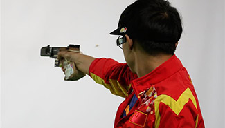 China's Li Yuehong takes bronze medal of men's 25m rapid fire pistol final of shooting at Olympic Games