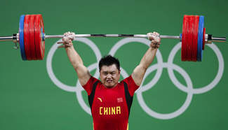 China's Yang Zhe competes in men's 105KG weightlifting group A