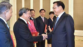 Chinese Premier presents certificates of appointment to counsellors, researchers