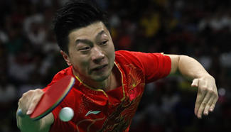 Ma Long competes at men's team gold medal match of Tabel Tennis