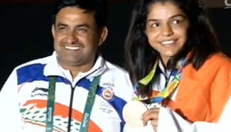 Indian wrestler Malik wins India's first medal
