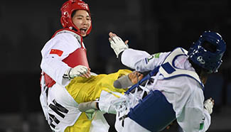 China's Zheng Shuyin wins gold medal of women's +67kg taekwondo