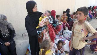 Families gather at Khaled office to flee away from IS militants
