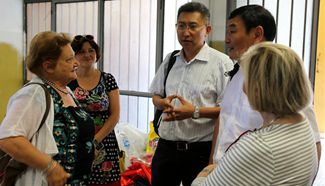 Chinese Embassy members in Italy visit Chinese students in quake-hit Sarnano
