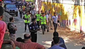 Security personnel block road near gunbattle in Bangladesh