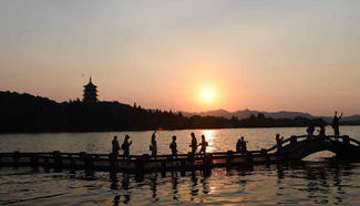 Scenery of Leifeng Pagoda at sunset in Hangzhou, E China