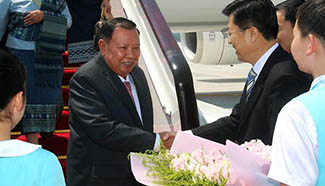 Lao president arrives in Hangzhou to attend G20 Summit