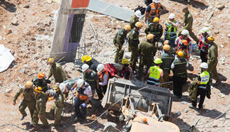Two killed, dozens injured in building collapse in Tel Aviv