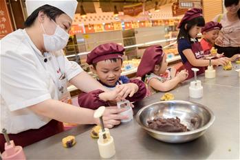 Moon cake making events for children organized ahead of Mid-Autumn Festival