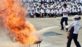 Students attend fire drill at Yunnan Normal University