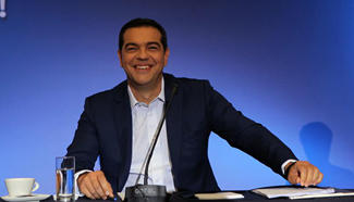 Greek PM says economy recovering, calls on investors to seize opportunities