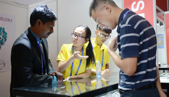Volunteers help foreign exhibitors at 13th China-ASEAN Expo in Nanning