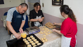 Pastry cooks make moon cakes in Cairo, Egypt
