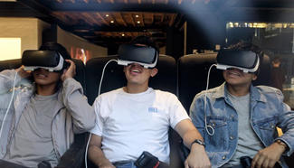 Young men enjoy Samsung Gear VR Virtual Reality Headsets at flagship store in New York