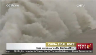 Huge waves roar up the Qiantang River