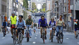 People ride bicycles during yearly car free day in Brussels