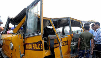 School bus falls into drain in India