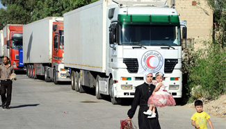 Latest relief aid from UN, SARC enter besieged town in Syria