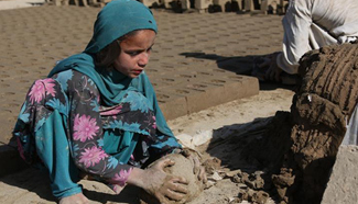 Afghan children work at brick factory in Kabul