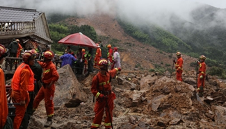 Rescuers work at accident site after east China landslides