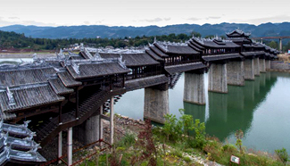 Tourists visit covered bridge in SW China's Chongqing