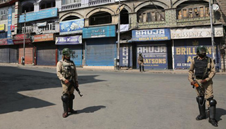Indian paramilitary soldiers stand guard in Srinagar, Indian-controlled Kashmir