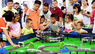Parents take children to sci-tech activities over National Day holiday