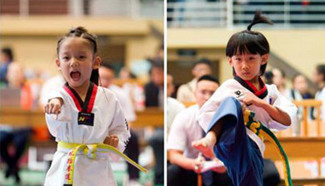 Children take part in competition of taekwondo, north China