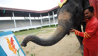 22-year-old elephant draws water color painting in Bangkok