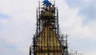 Workers reconstruct Boudhanath Stupa in Kathmandu, Nepal