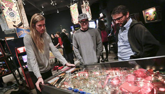 People participate in Public Pinball Tournament in Vancouver