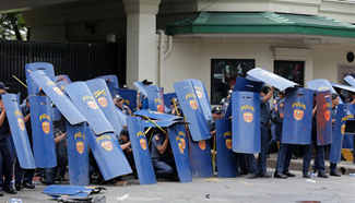 Policemen scuffle with activists in Manila, the Philippines