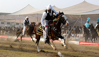 Horse riders participate in tent pegging competition in Pakistan's Lahore