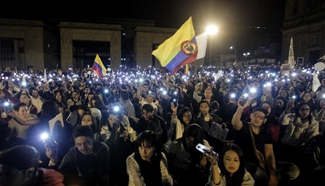 Colombians attend "March of the Light" for peace talks with FARC