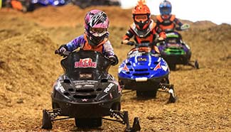 Young riders compete during Mini ATV Race