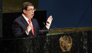 UN adopts resolution urging end to Cuban embargo, U.S. abstains for first time