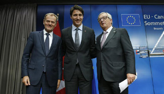 EU, Canada sign landmark free trade deal after Belgian drama