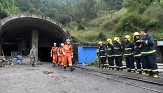 Search continues for 20 missing miners in China pit