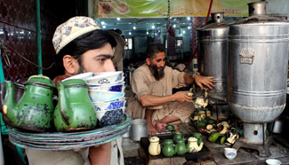 Pakistani people drink green tea in Peshawar