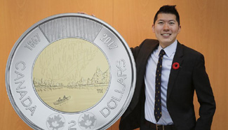 New circulation toonie for Canada's 150th birthday designed by Hsia