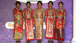 Models present wedding dresses at HK Wedding Expo