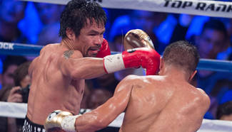 WBO welterweight title boxing match: Pacquiao beats Vargas